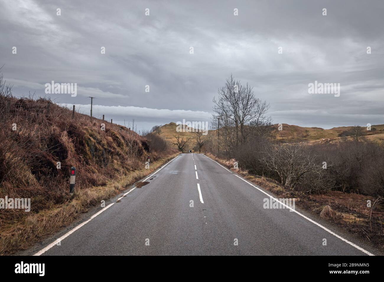 Scenic asphalt road across wild landscape of teh West Coast of Scotland Stock Photo