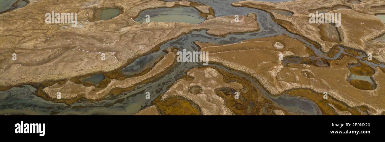 Abstract aerial patterns of wetland near the Chatyr-Kul lake in Kyrgyzstan. The Ramsar Convention on Wetlands of International Importance especially a Stock Photo
