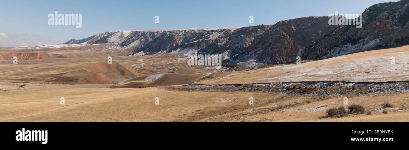 morning autumn near winter landscape along the Mels-Ashu pass, also called Börülü ashuu pass in the Tian Shan mountains of Kyrgyzstan Stock Photo