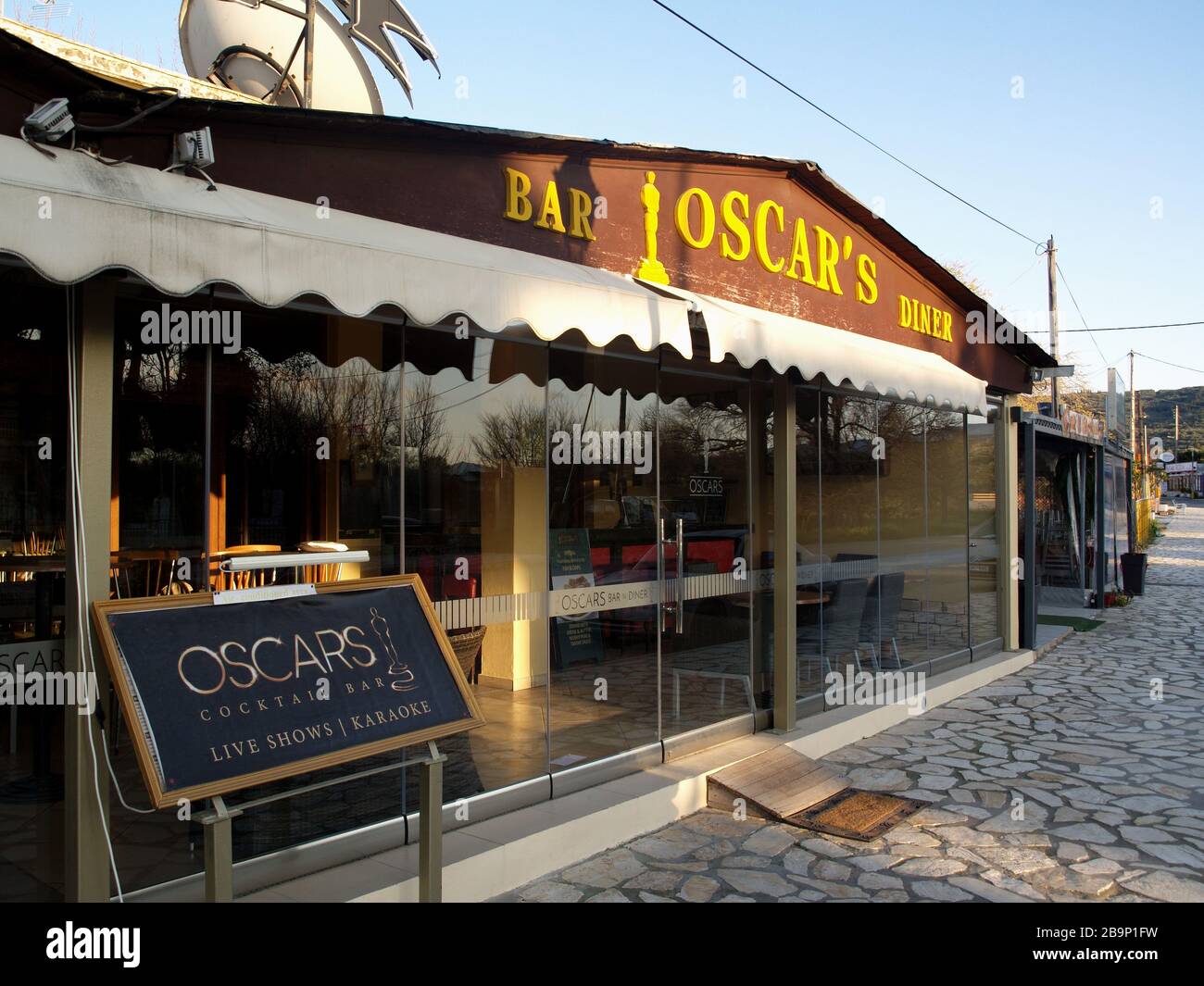 A normally busy bar in Roda, Corfu, Greece deserted during the social distancing measures  of the Coronavirus  crisis Stock Photo