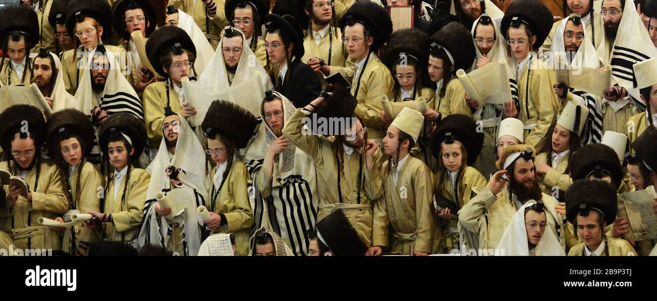 Hassidic Jewish Men Celebrating Purim Festival In Their Yeshiva Bible hassidic-jewish-men-celebrating-purim-festival-in-their-yeshiva-bible