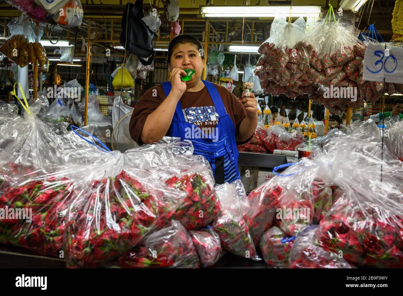Venders in the Pak Khlong Flower Market, Bangkok, Thailand Stock Photo