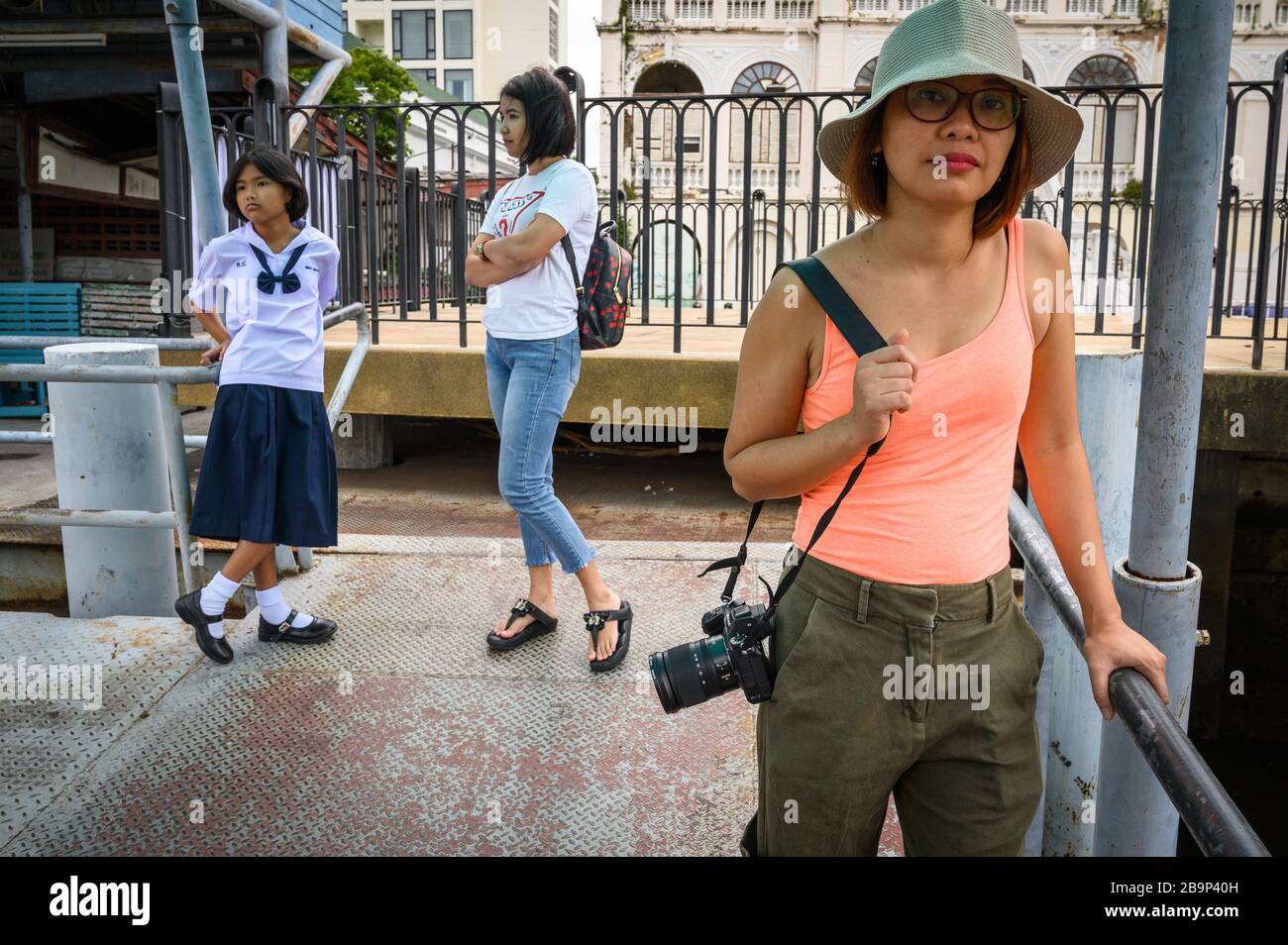 A solo traveling Vietnamese woman with her camera, Thailand Stock Photo