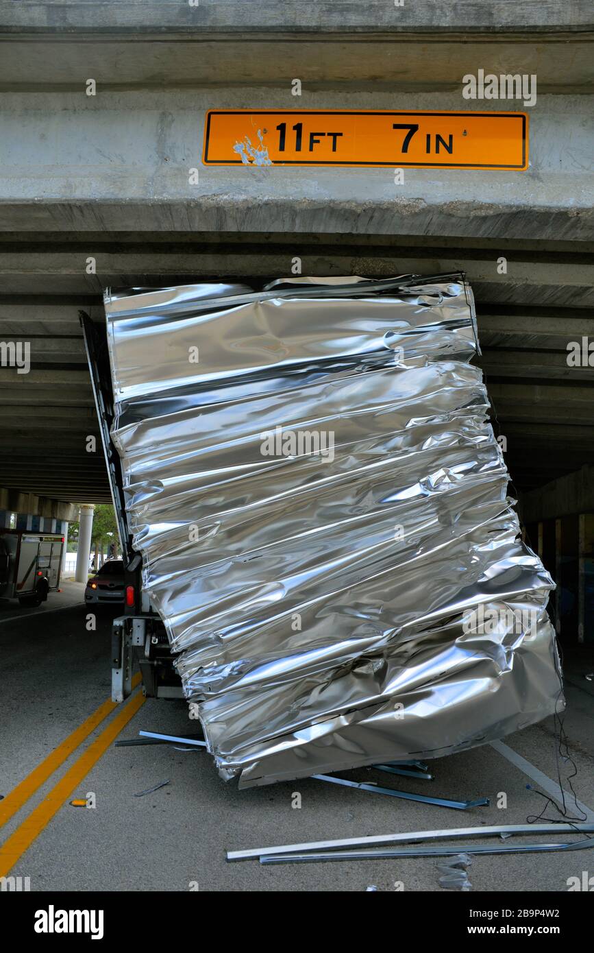 Melbourne, Florida, USA. March 24, 2020. Melbourne Police Department closed off a section of Melbourne Ave. due to an oversize box truck getting stuck under the US1 overpass. Melbourne Fire Department deflated the trucks tires so that the truck could be removed from the bridge. State DOT and Road and Bridge inspected the bridge for damage. Credit: Julian Leek/Alamy Live News Stock Photo