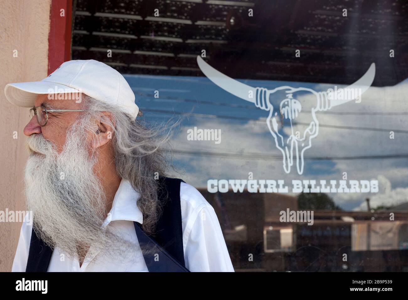 An elderly man stands outside a business in Santa Fe, New Mexico. Stock Photo