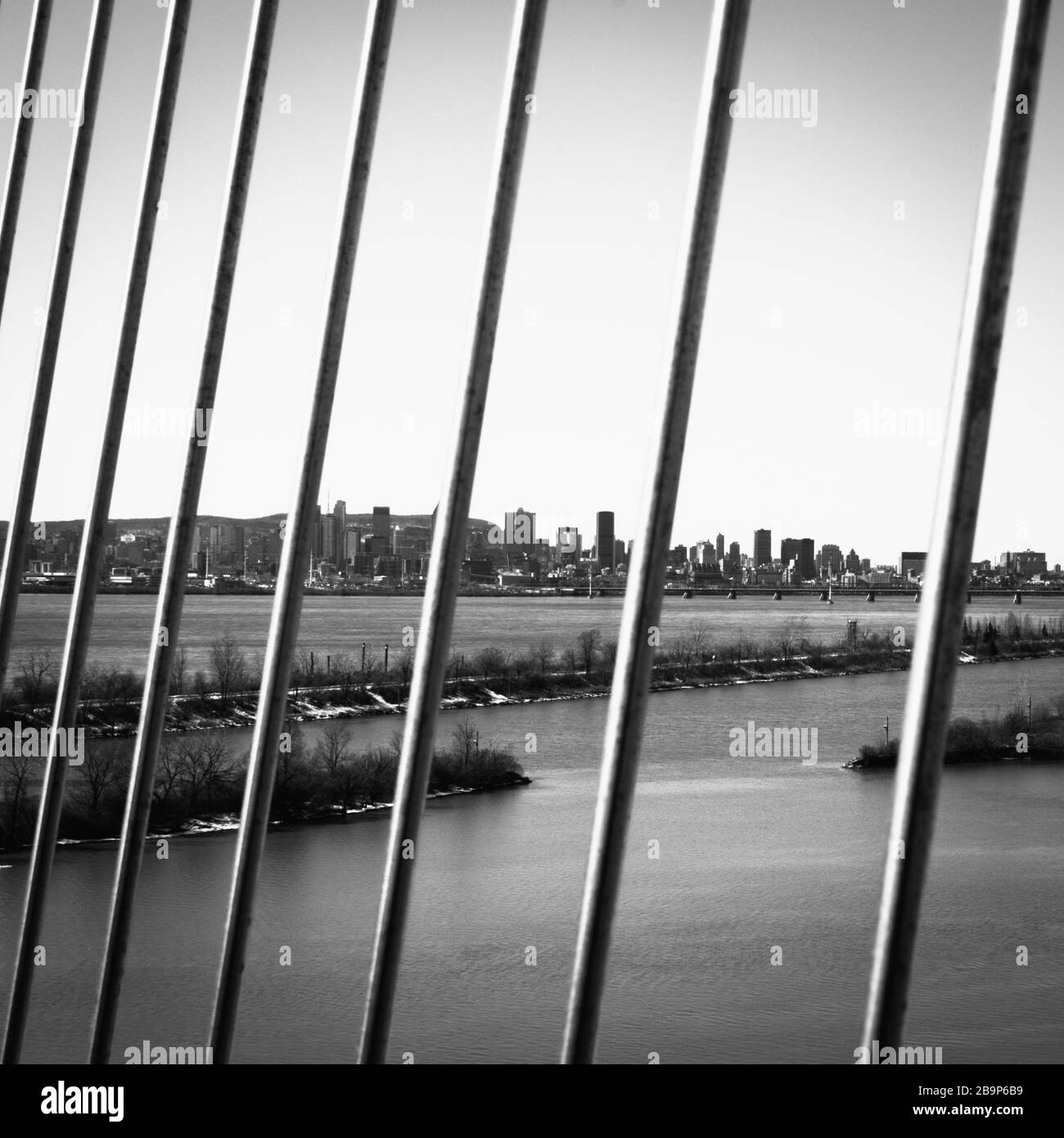 Montreal on Break during COVID-19 - concept b&w - city skyline with lattice foreground Stock Photo