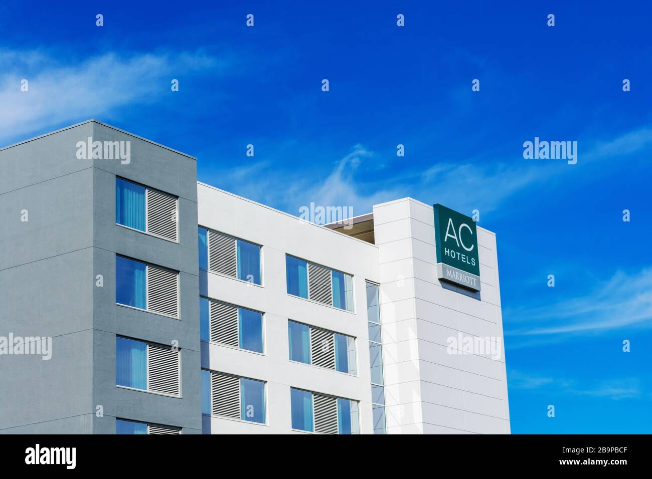 AC Hotels Marriott sign on a European inspired hotel under blue sky - South San Francisco, California, USA, California, USA - 2020 Stock Photo