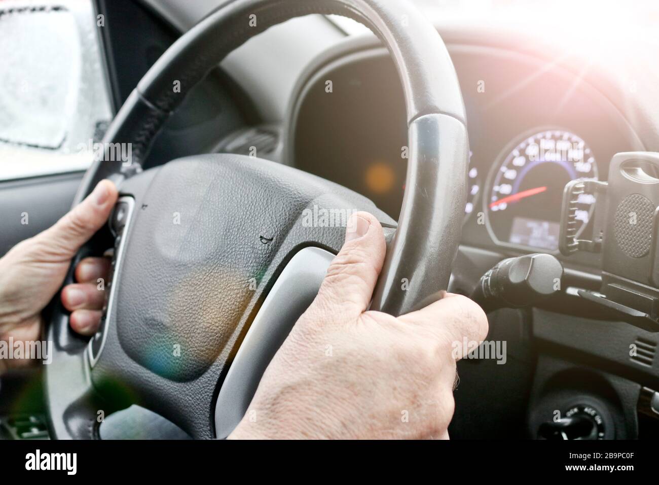 Driver hands behind wheel hi-res stock photography and images - Alamy