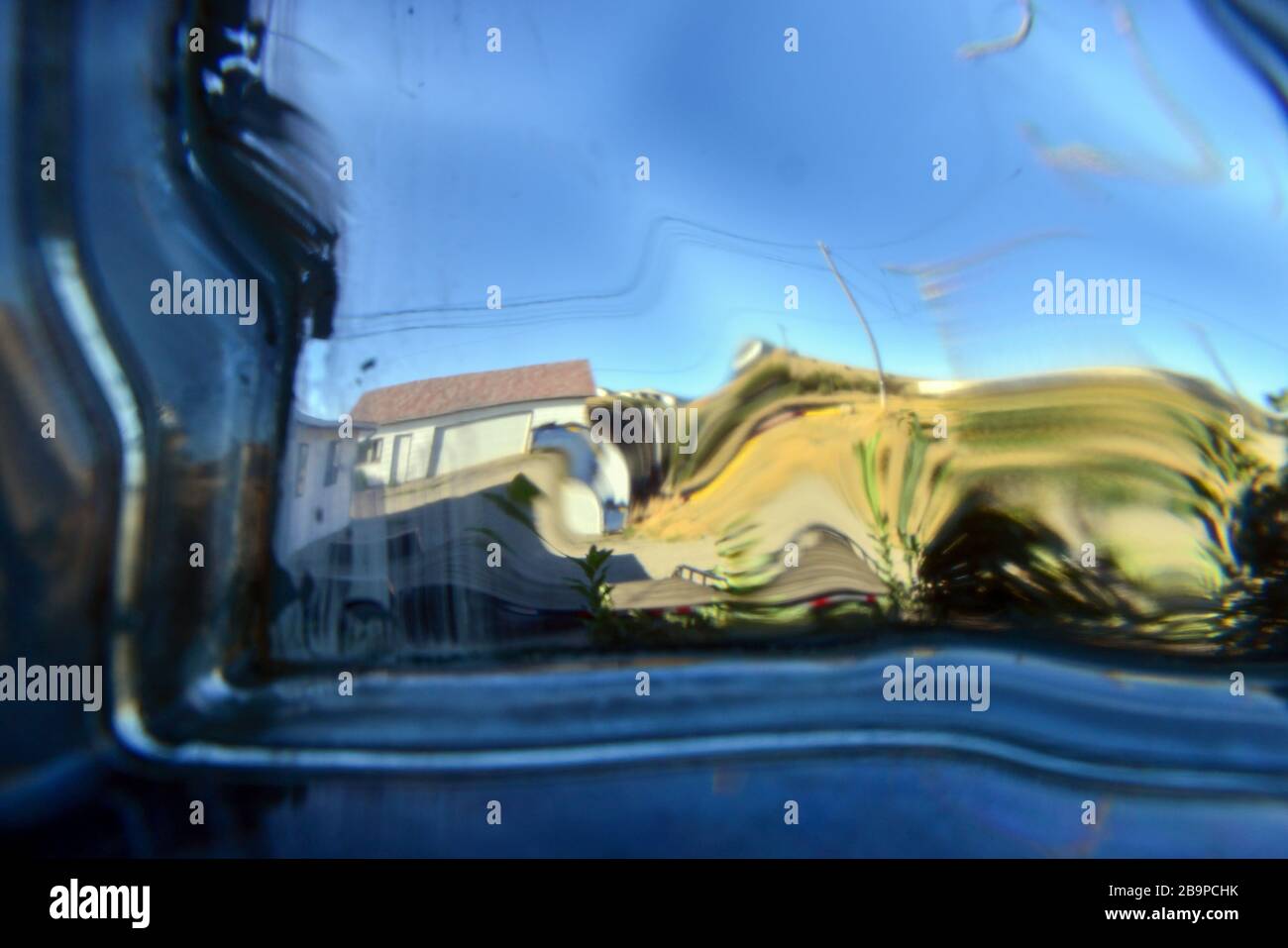 Buildings distorted through a glass block window Stock Photo - Alamy
