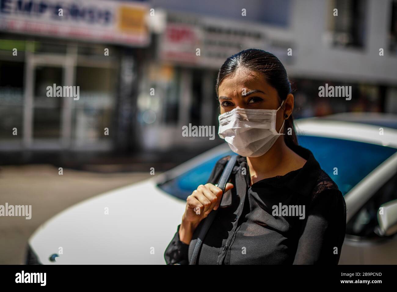 Daily life in the center of Hermosillo during the quarantine period due to the virus that has gone from an epidemic to a global pandemic that has affected daily life, health and commerce. Images of people wearing a mouth covering, one as a preventive measure against the spread of the coronavirus or conavid-19, Hermosillo, Sonora on March 24, 2020. ...  Vida cotidiana en el centro de Hermosillo durante el periodo de cuarentena por el virus que ha pasado de epidemia a una pandemia global que ha afectado la vida cotidiana, la salud y el comercio. Imagenes de personas portando un cubre bocas, una Stock Photo