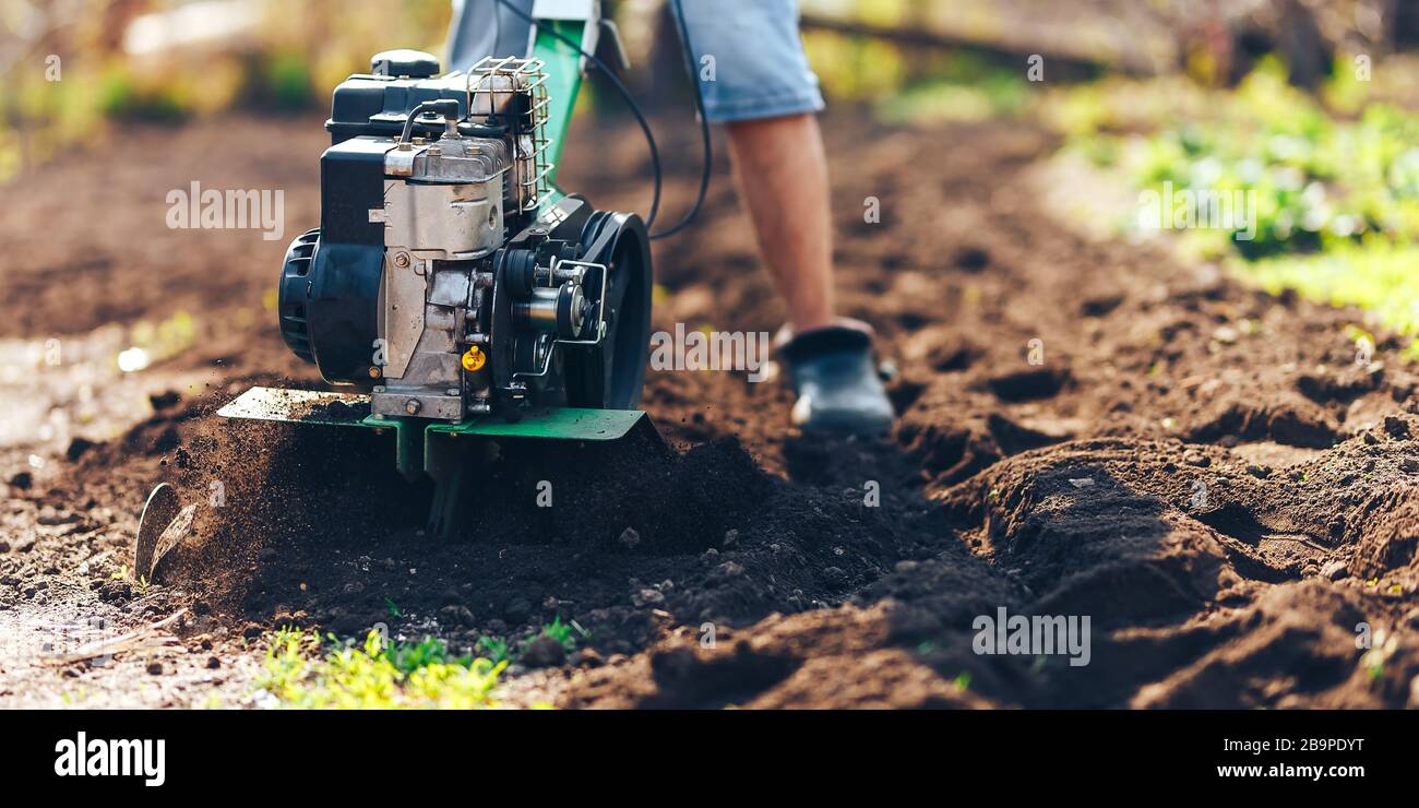 close up photo of young farmer gardener cultivate ground soil ...