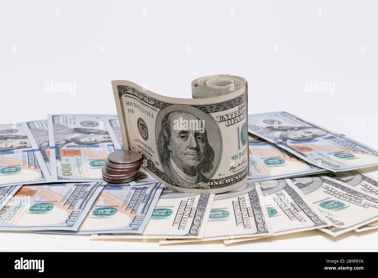 Hundred American dollars and coins. Stock Photo
