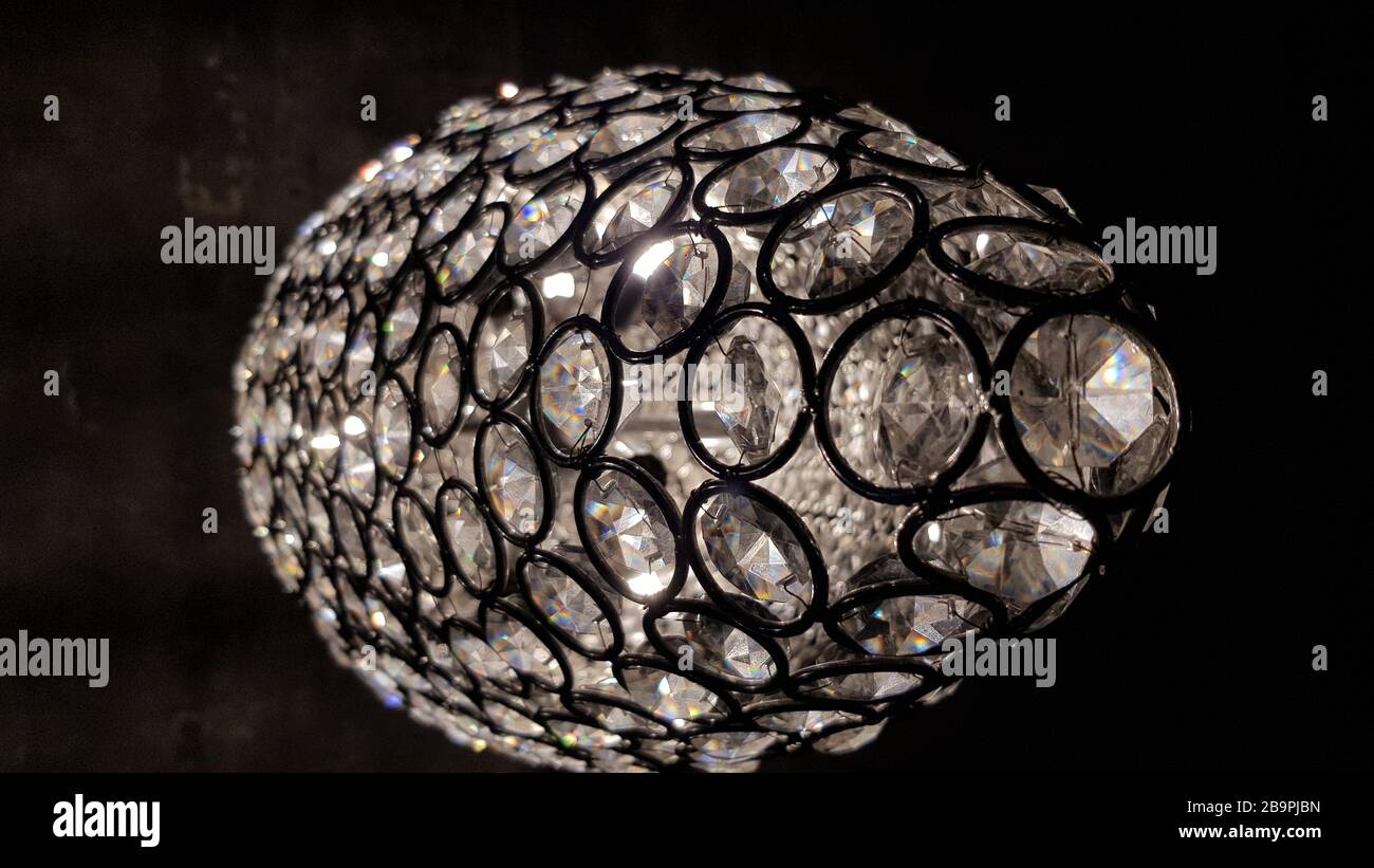 Glowing scales with crystal round elements inside. Shiny surface of glass  chandelier. Modern sparkling glass lampshade texture looks like disco ball  Stock Photo - Alamy