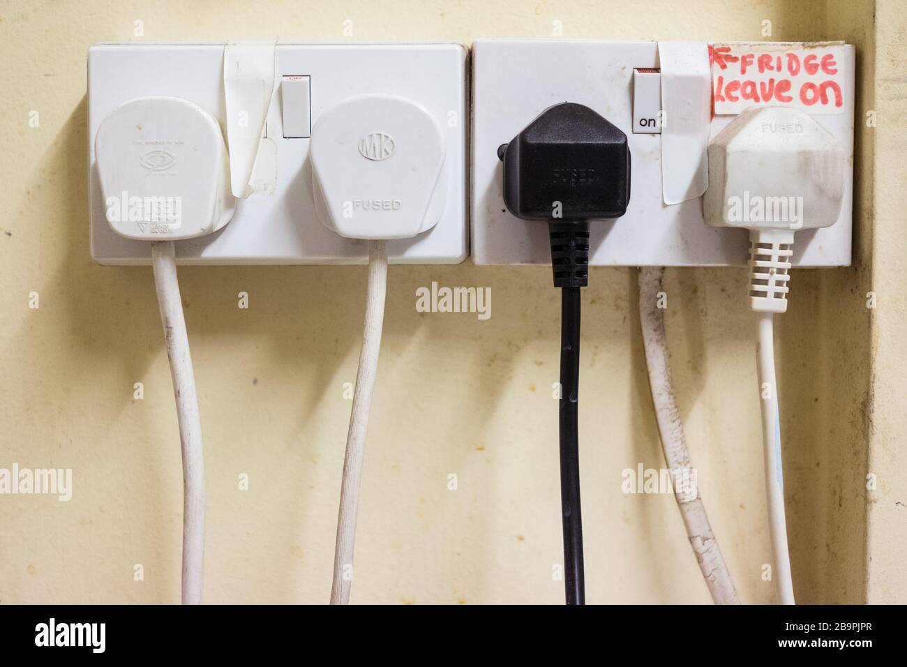 Plugs in sockets Stock Photo