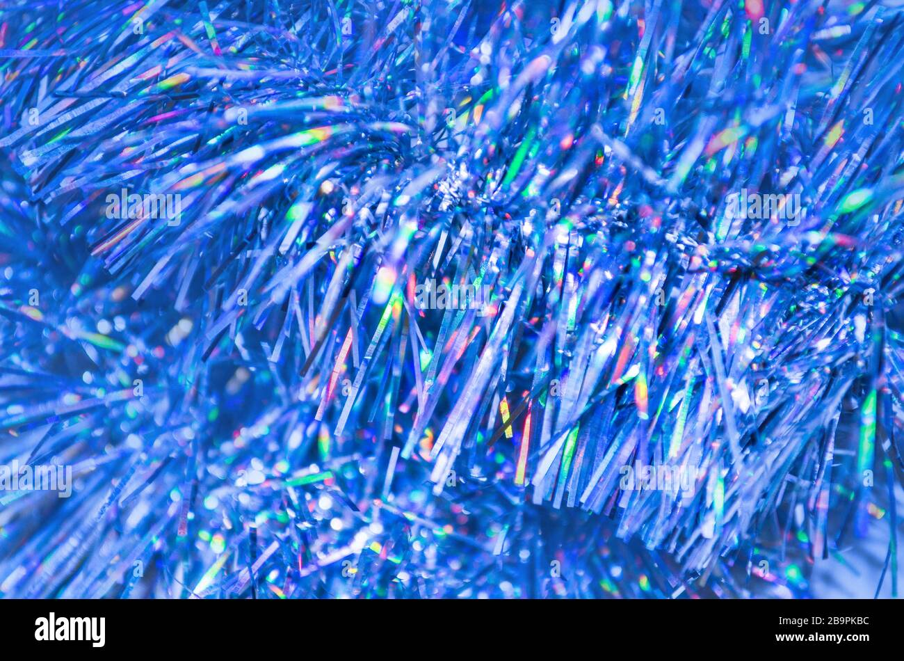 Christmas blue garland. Party celebration texture. Colorful  blue Christmas tinsel Stock Photo