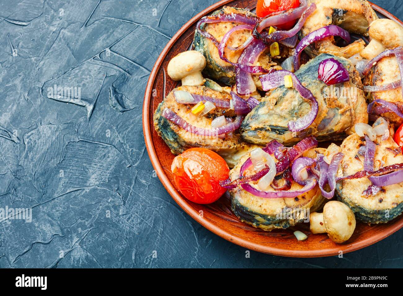 Roast fish with fish hi-res stock photography and images - Alamy