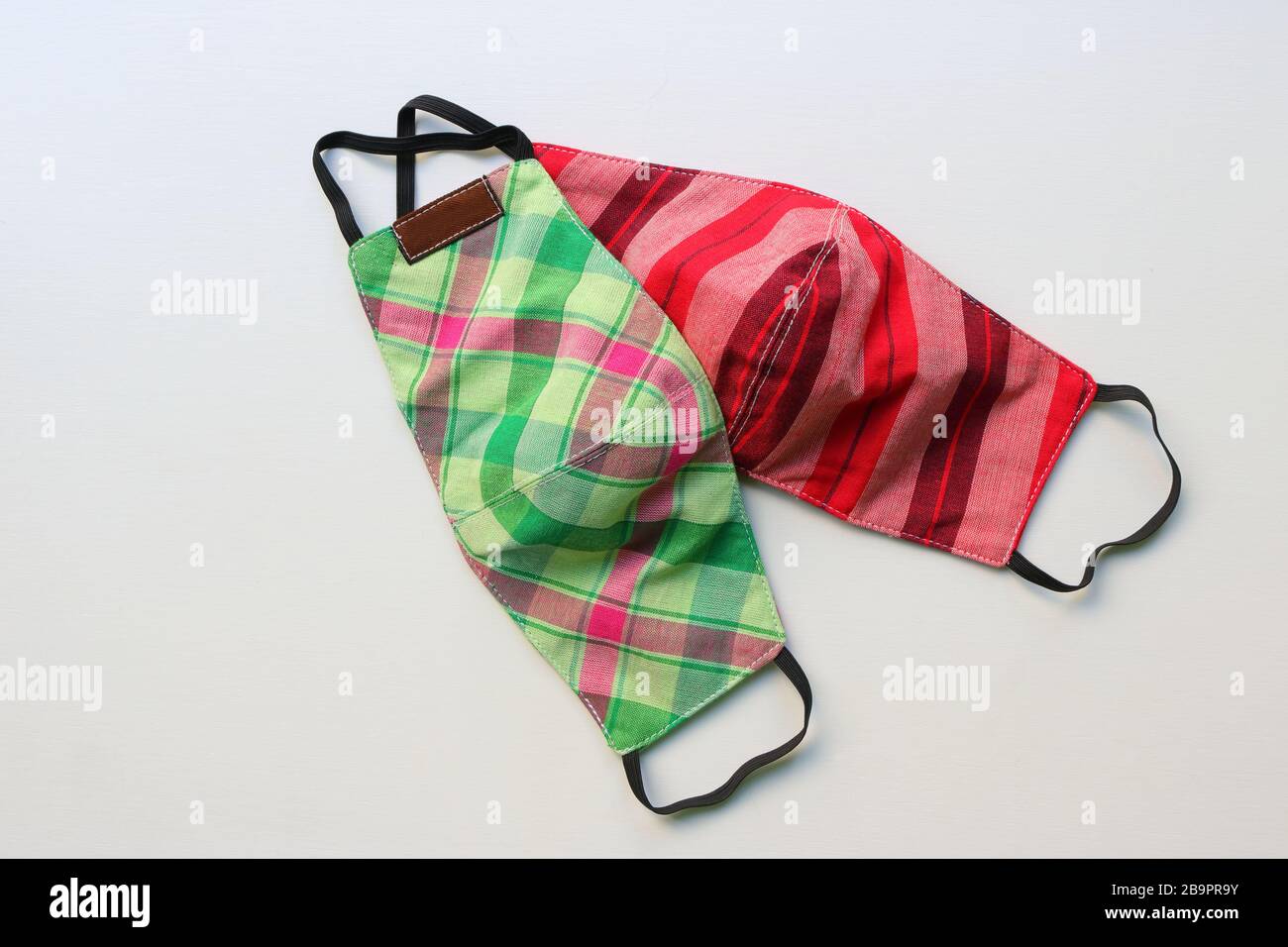 Handmade face masks made from plaid cloth, washable and reusable, can be used during shortage of surgical mask due to coronavirus outbreak Stock Photo