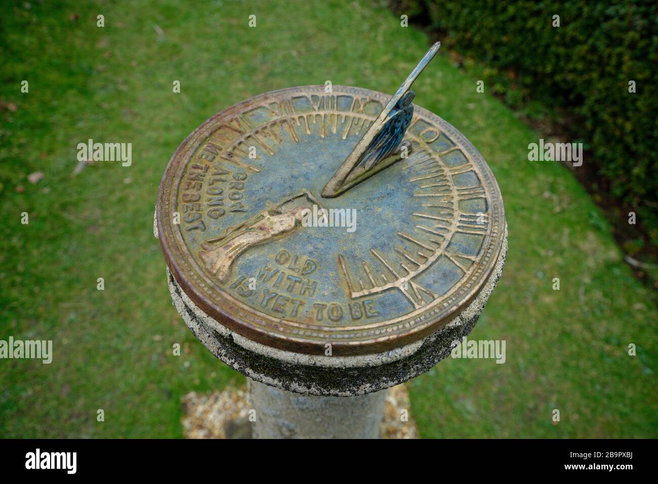 'Grow old along with me the best is yet to be' Inscription on this sundial. Stock Photo