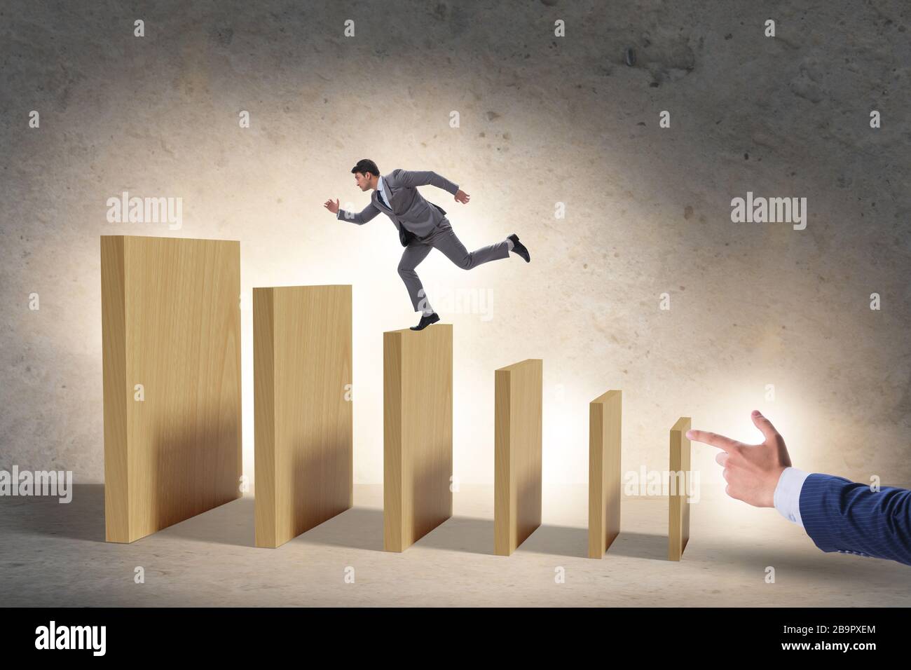 Domino effect and the competition concept Stock Photo - Alamy