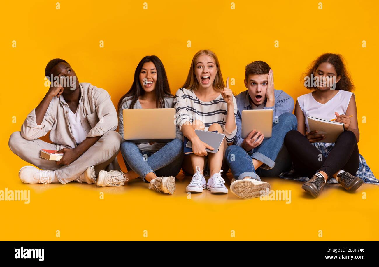 Group of exhausted students preparing together for university exams Stock Photo