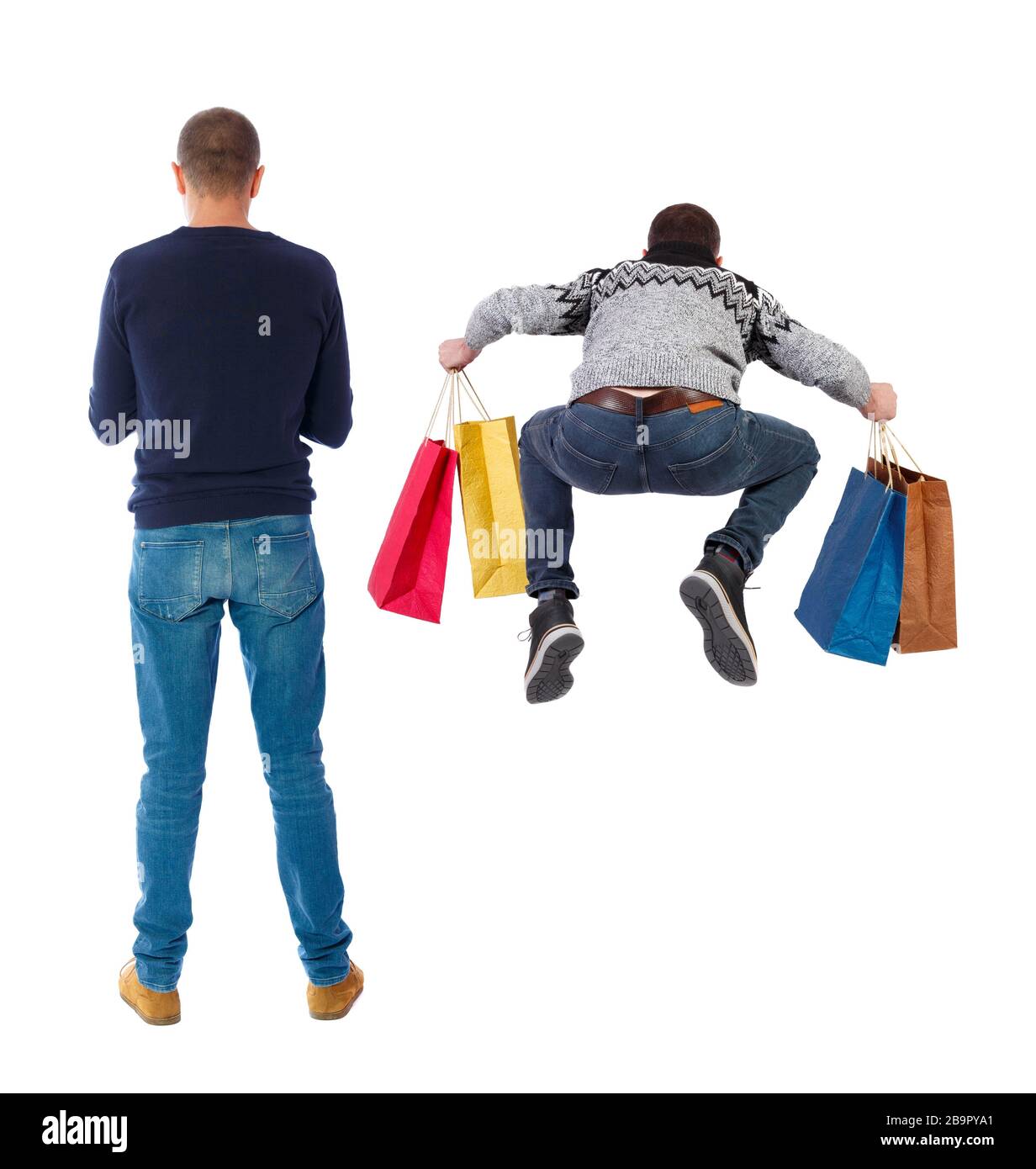 back view of two man with shopping bags. backside view of person. Rear ...