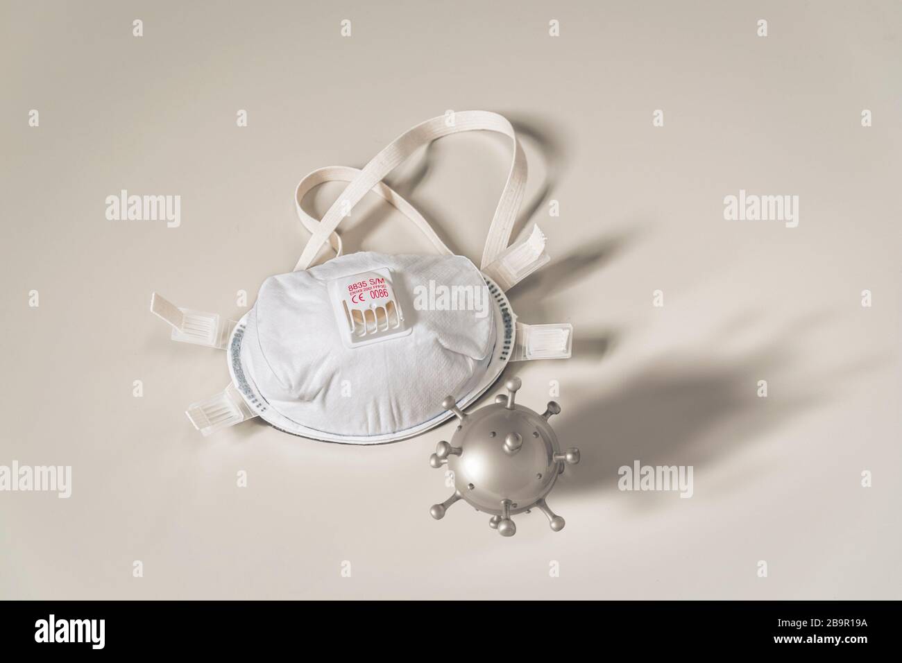 Respirator -  disposable medical mask and virus. Concept of hygiene and protection of human from contaminated environment. Copy space for text. Stock Photo