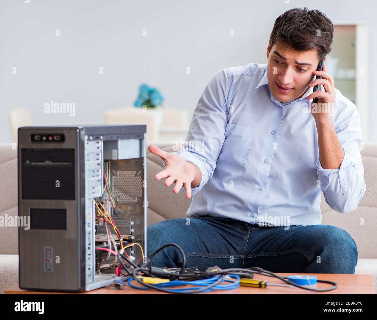 The angry customer trying to repair computer with phone support Stock ...