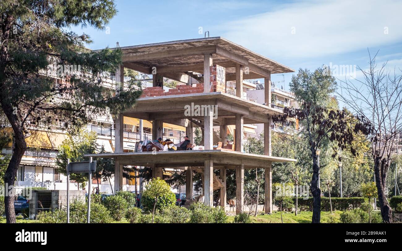 Athens, Greece - February 12, 2020. homeless people in an unfinished ...