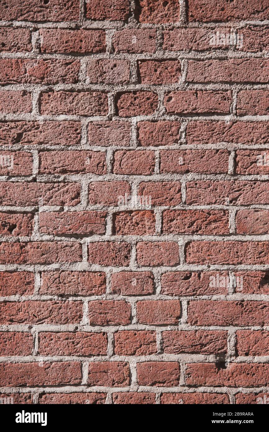 Vertical Red Brick Wall Rough Surface Texture Background Stock Photo