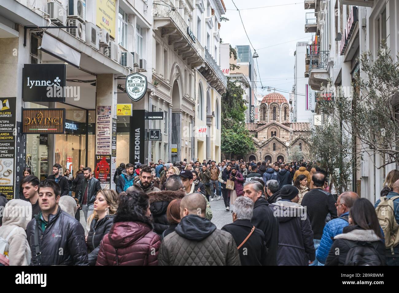 Athens, Greece - February 15, 2020. people walking the most famous street in Athens with luxury shops, Ermou street Stock Photo