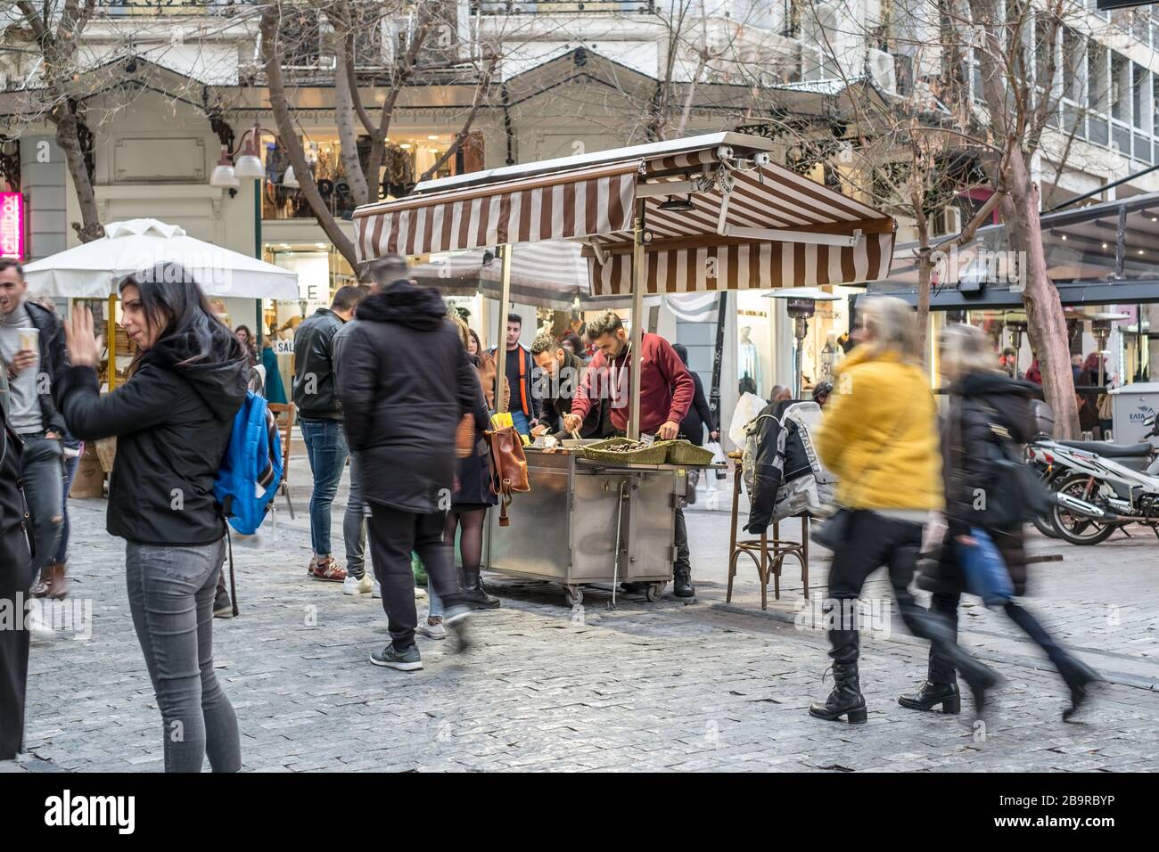 Athens, Greece - February 15, 2020. people walking the most famous street in Athens with luxury shops, Ermou street Stock Photo