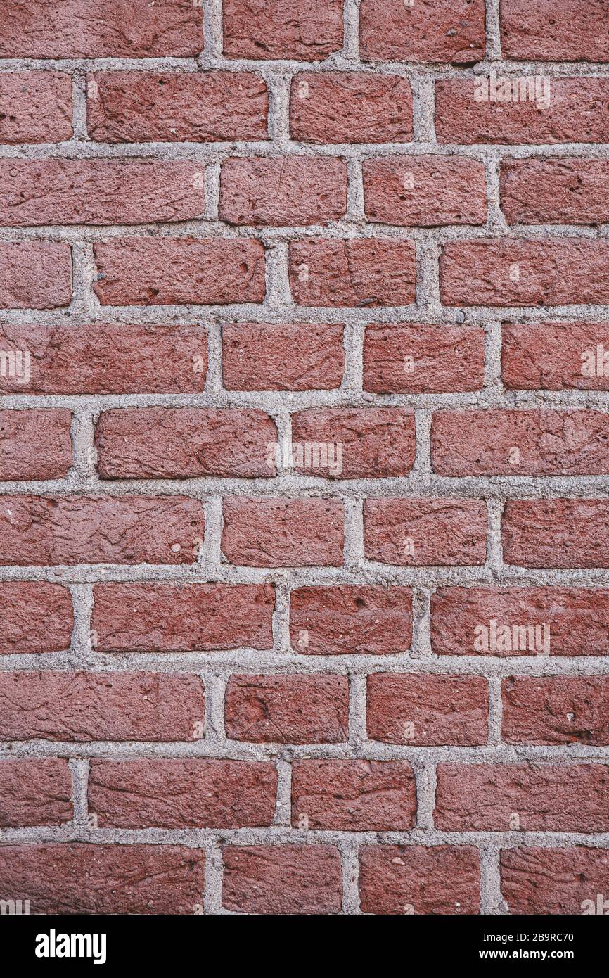 Vertical Red Brick Wall Rough Surface Texture Background Stock Photo