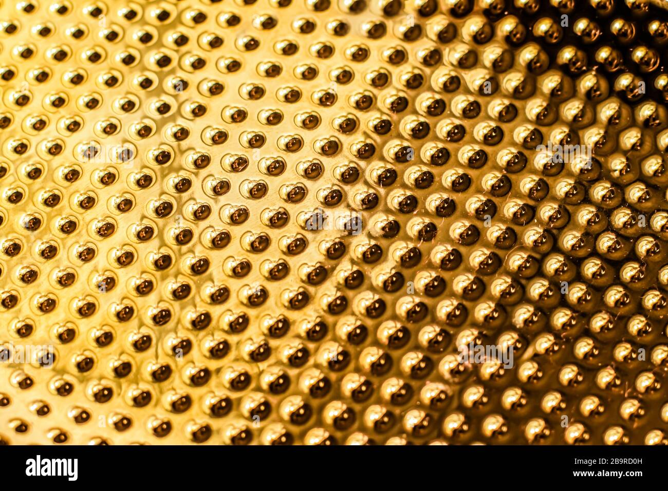 Texture of golden metallic surface as background, materials and ...
