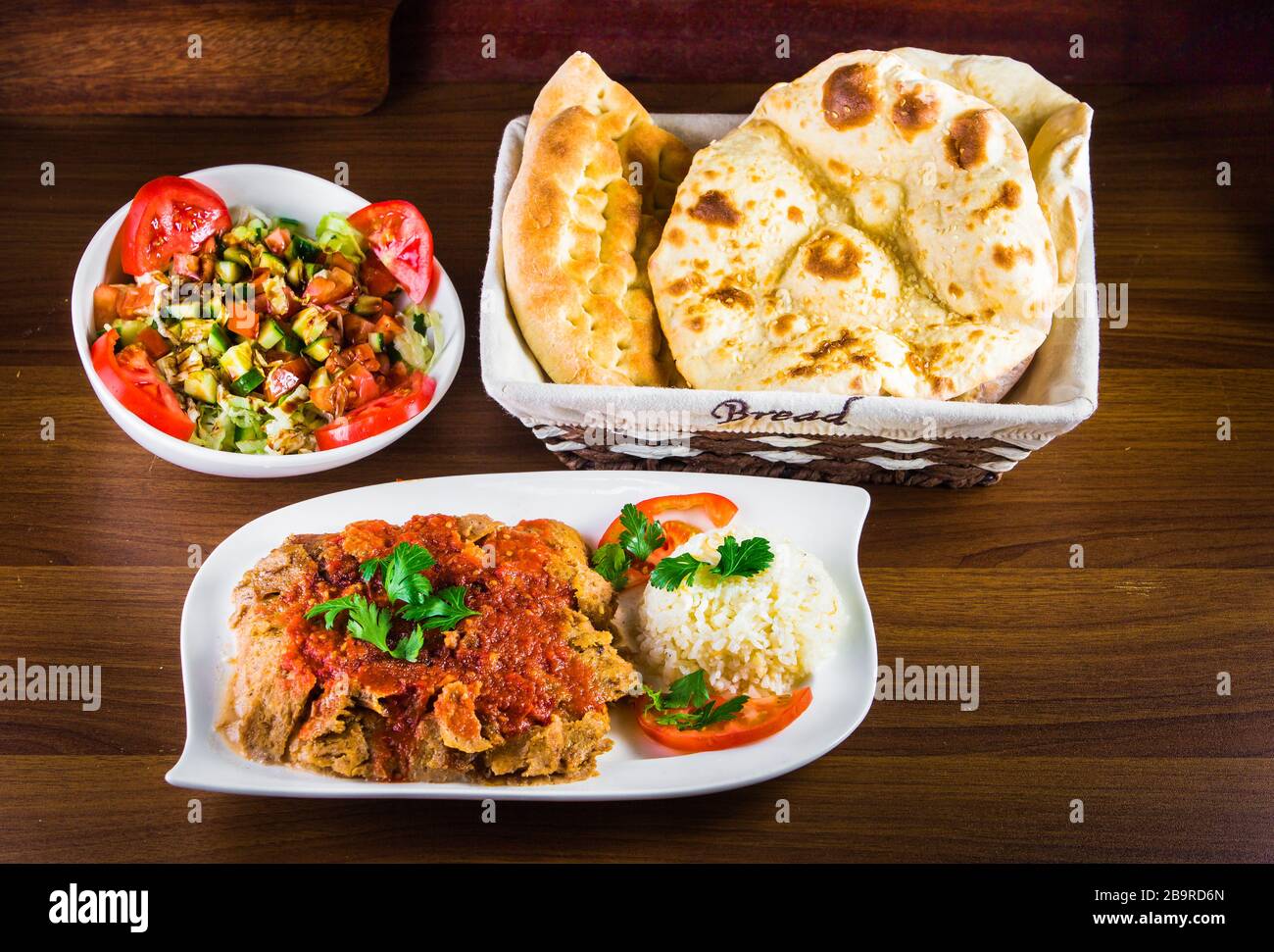 Traditional Turkish iskender kebap doner served with special red sauce