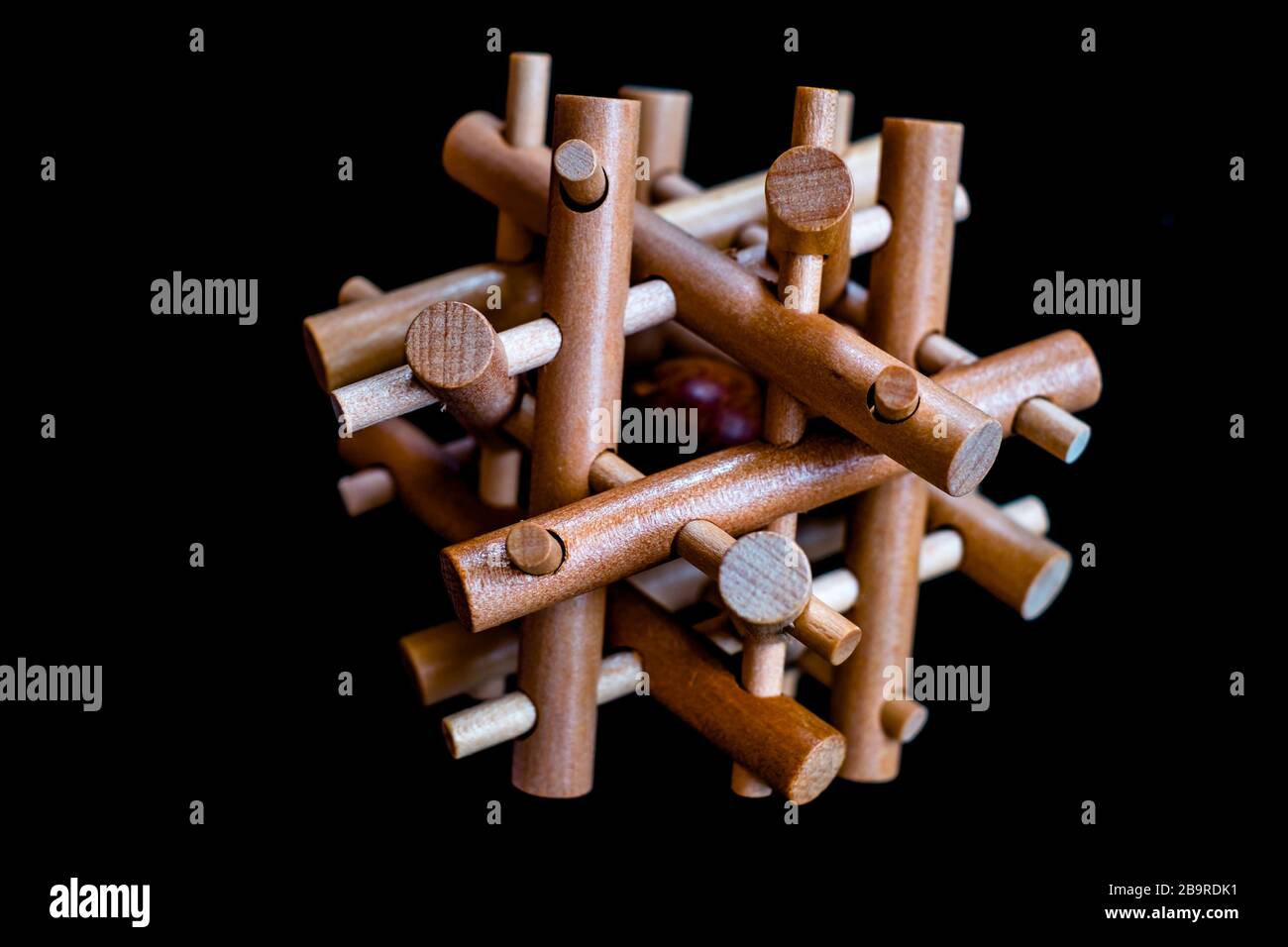 Wooden Brain Bamboo Puzzle on black background Stock Photo - Alamy