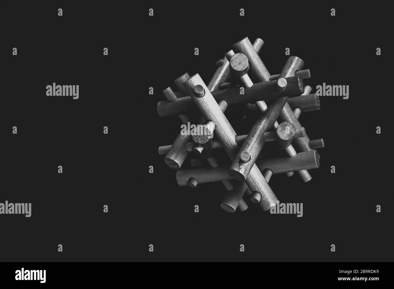 Wooden Brain Bamboo Puzzle on black background Stock Photo - Alamy