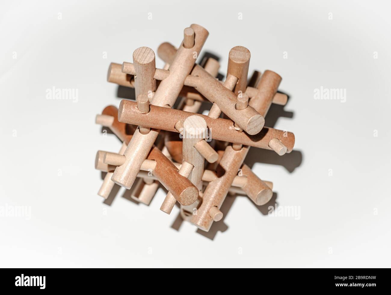 Wooden Brain Bamboo Puzzle on white background Stock Photo - Alamy
