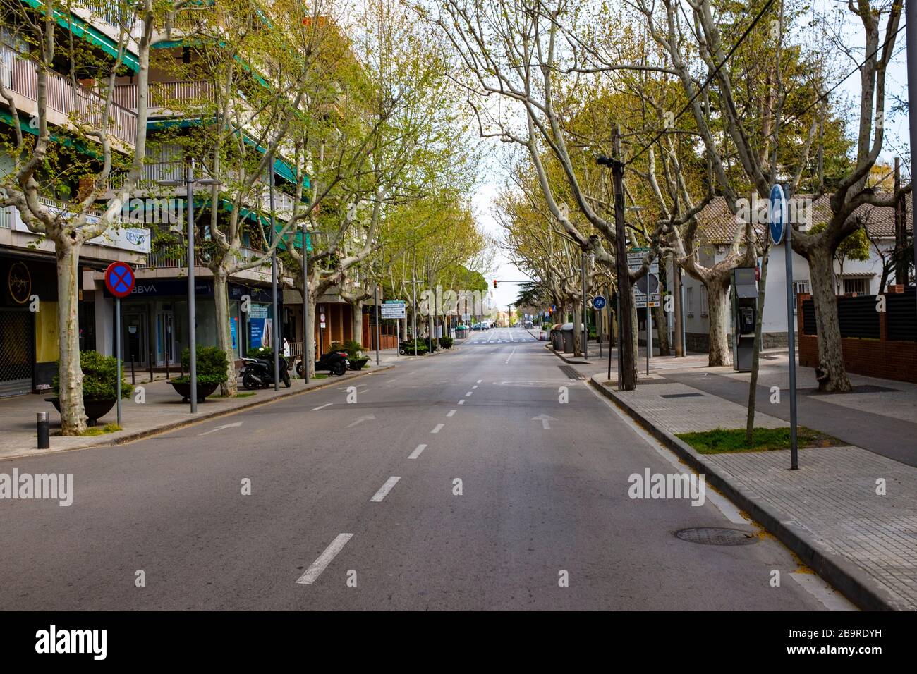 Normally busy Rambla de Ribatallada, devoid of traffic. 21 March 2020 - one week into lockdown. Empty streets in Sant Cugat del Valles, a normally bus Stock Photo