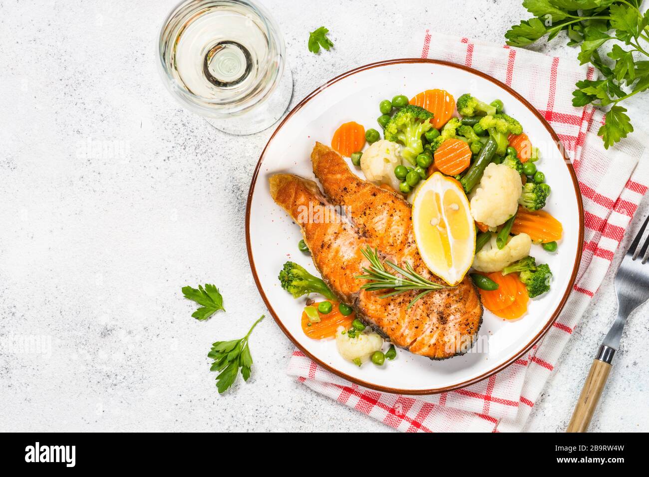Grilled salmon fish steak with vegetables on white Stock Photo - Alamy