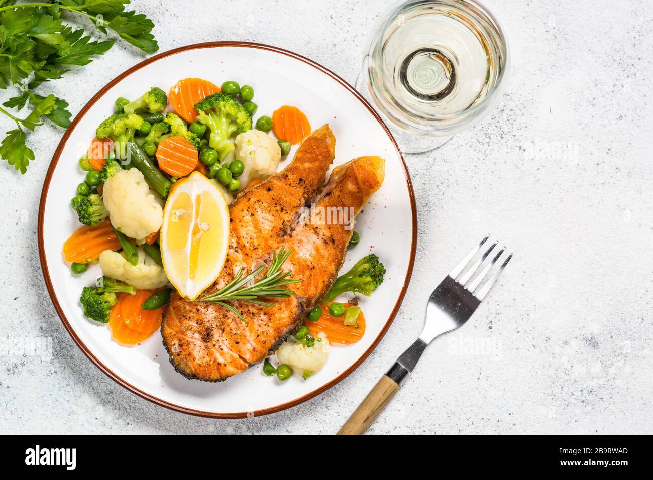 Grilled salmon fish steak with vegetables on white Stock Photo - Alamy