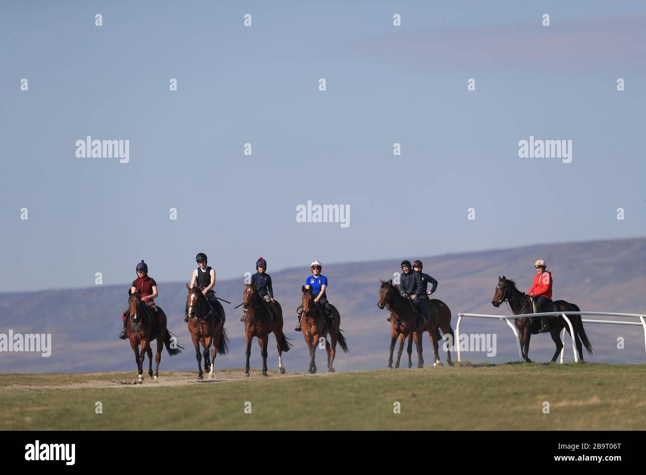 Racehorses at the gallops in Middleham. Trainers are being advised to continue gallops exercise, and adhere strictly to social-distancing requirements, following Prime Minister Boris Johnson’s announcement of new measures to combat the spread of coronavirus. Stock Photo