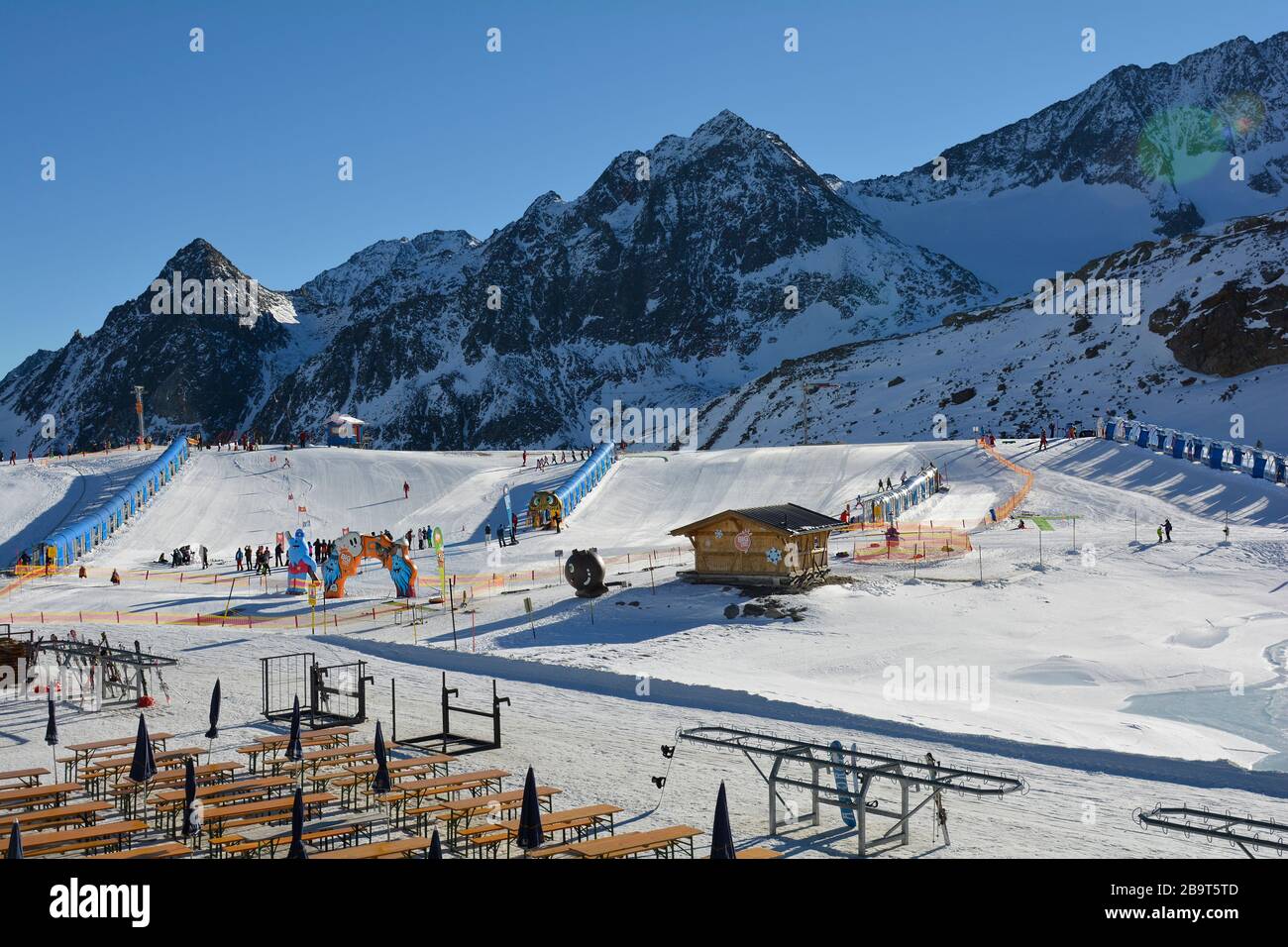 Stubai, Austria - December 23rd 2015: Unidentified people on practice slope with children lift on ski resort Stubaier glacier Stock Photo