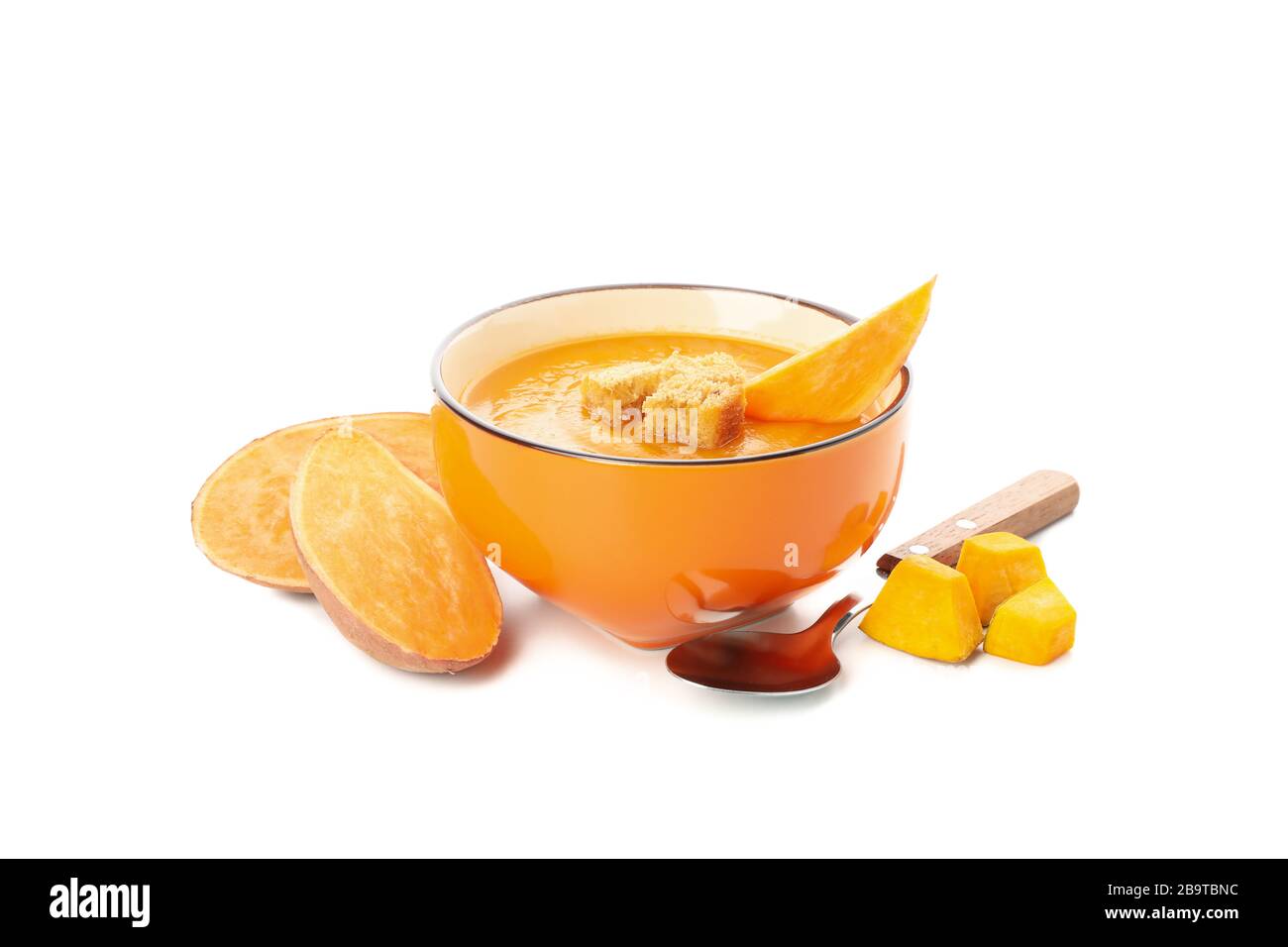Sweet potato cream soup isolated on white background Stock Photo - Alamy