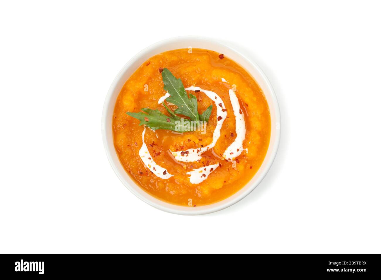 Pumpkin cream soup isolated on white background Stock Photo - Alamy