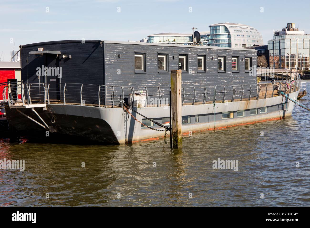 Houseboats moored on Cheyne Wharf, on the River Thames by Chelsea Embankment, next to Cheyne