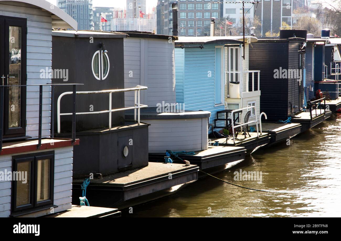 Houseboats moored on Cheyne Wharf, on the River Thames by Chelsea Embankment, next to Cheyne
