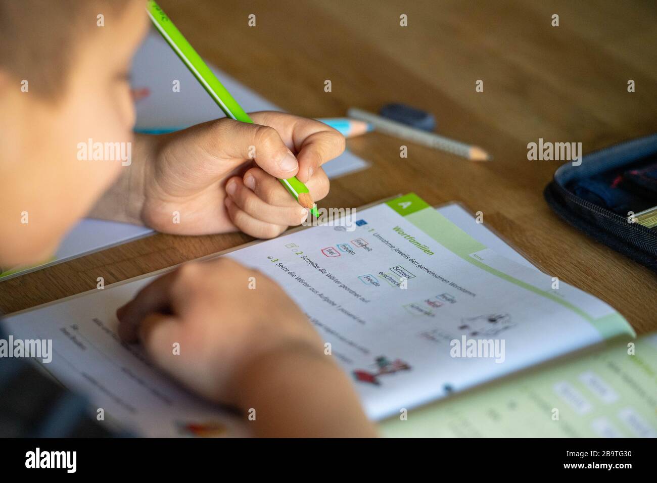 Joel solves his homework at home, learning in the corona crisis, on ...