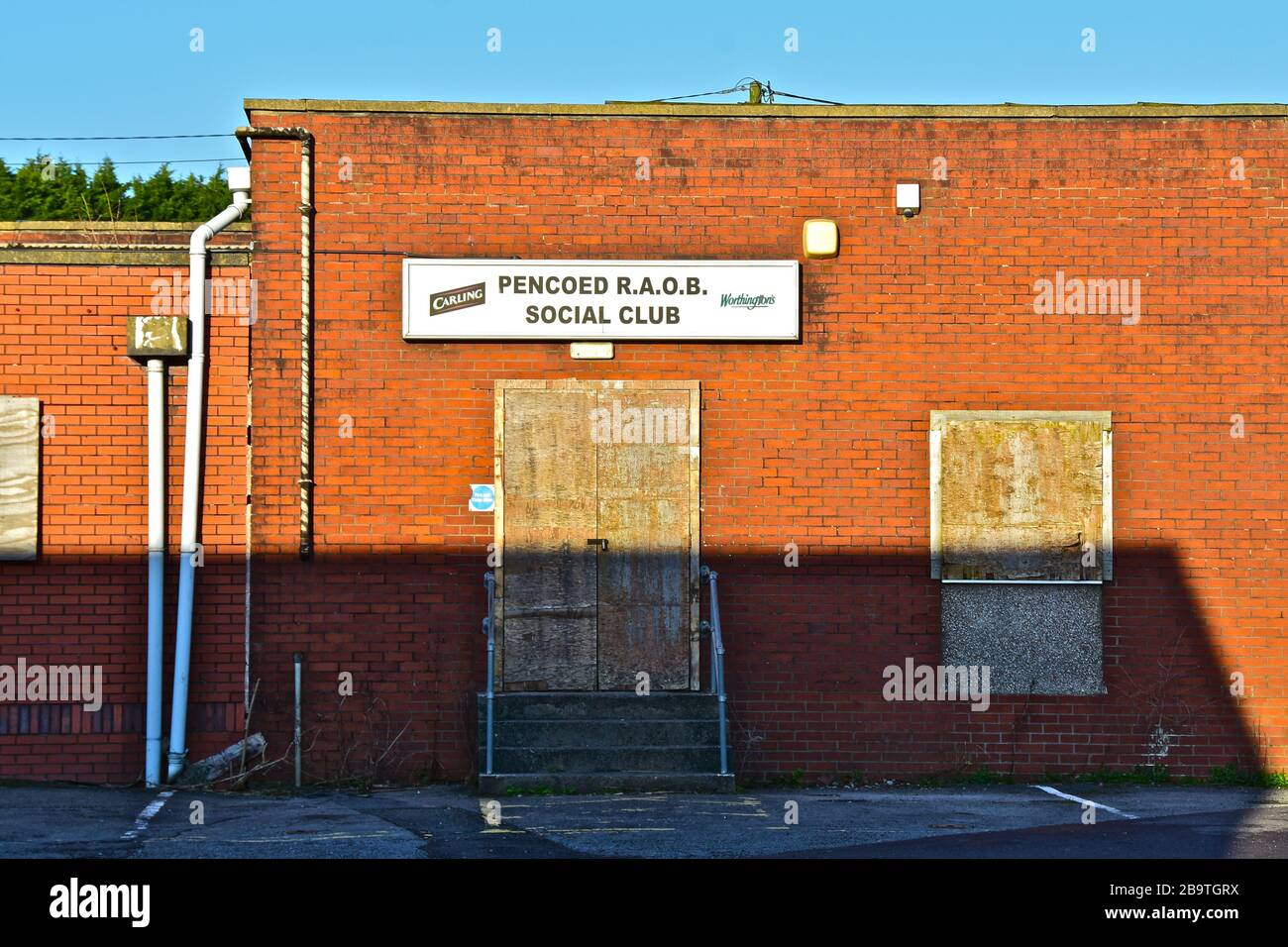 The boarded-up former RAOB Club (Royal Antediluvian Order of Buffaloes, or 'Buffs') is now closed and awaiting demolition,possibly to provide housing. Stock Photo
