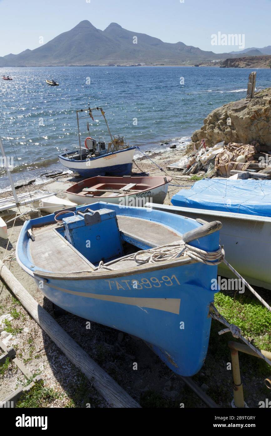 Fishing boats pulled up on the shore at Isleta del Moro, Almeria, Andalusia, Spain Stock Photo