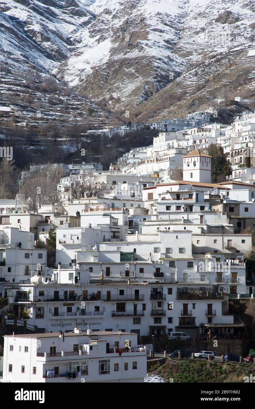 Trevelez village in a winter mountain landscape with snow, Granada province, Andalusia, Spain Stock Photo